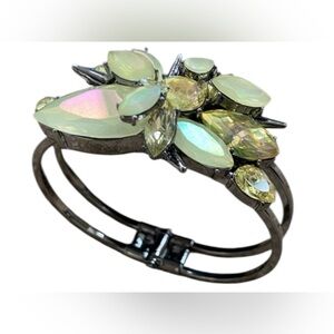 Erickson Beamon statement cuff bracelet featuring yellow crystals and stones.